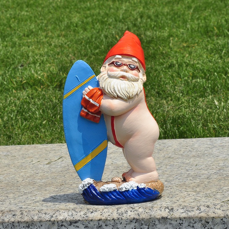 Gnome statue on a granite ledge in front of green grass