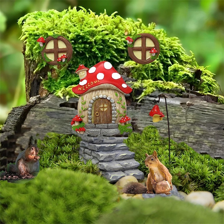 Mushroom fairy house on a stone path among moss and small figurines