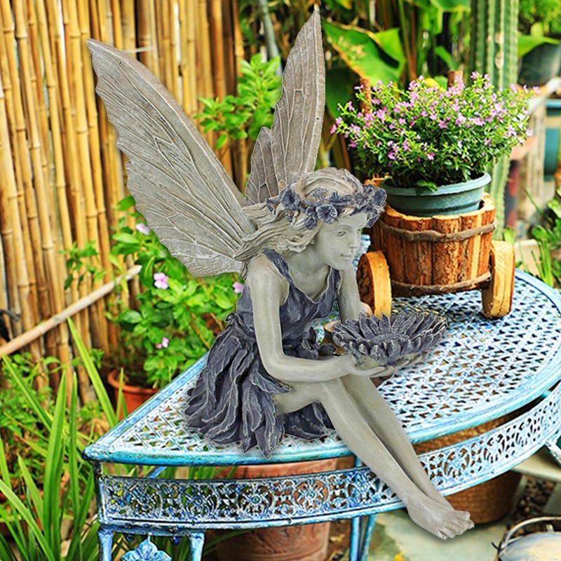 Resin fairy garden statue in soft natural light