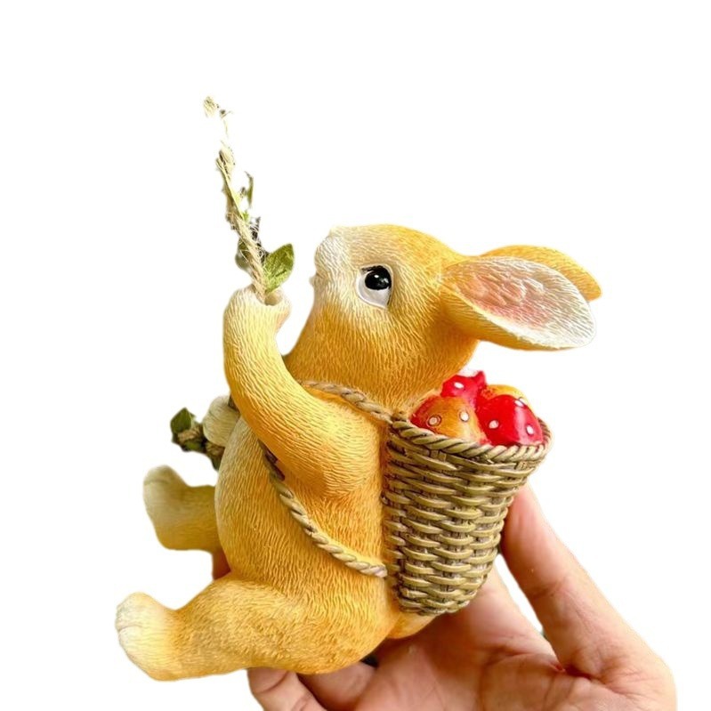 Honey-yellow resin rabbit with woven mushroom basket and jute hanger