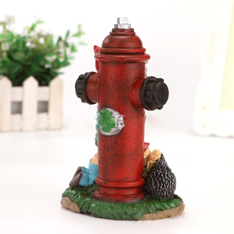 Back view of red hydrant with side caps and clover medallion