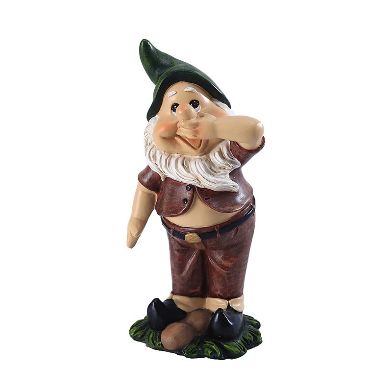 Resin garden gnome in green hat with hand over mouth beside grass base