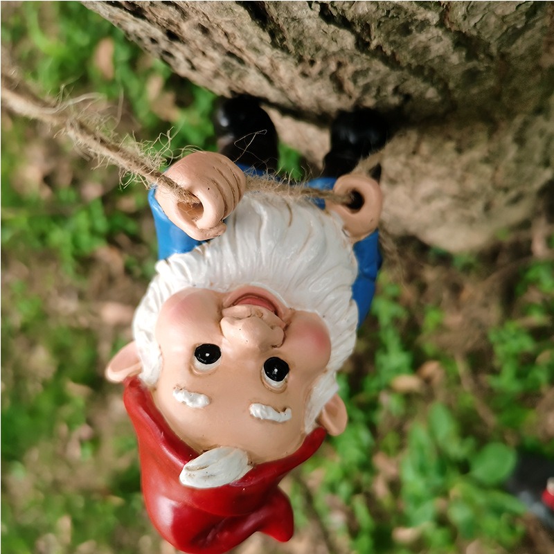Climbing gnome gripping jute rope against tree bark outdoors