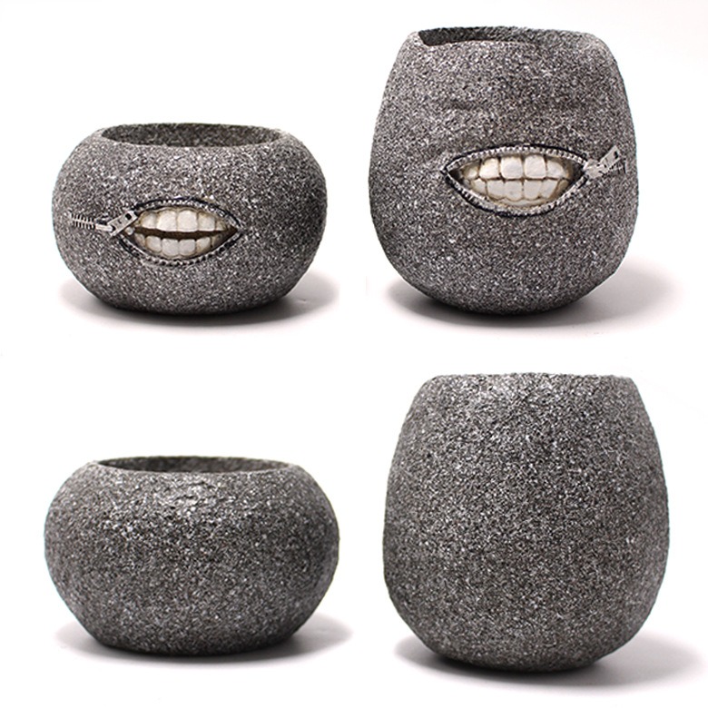 Grey resin planter showing speckled granite-look texture from several angles