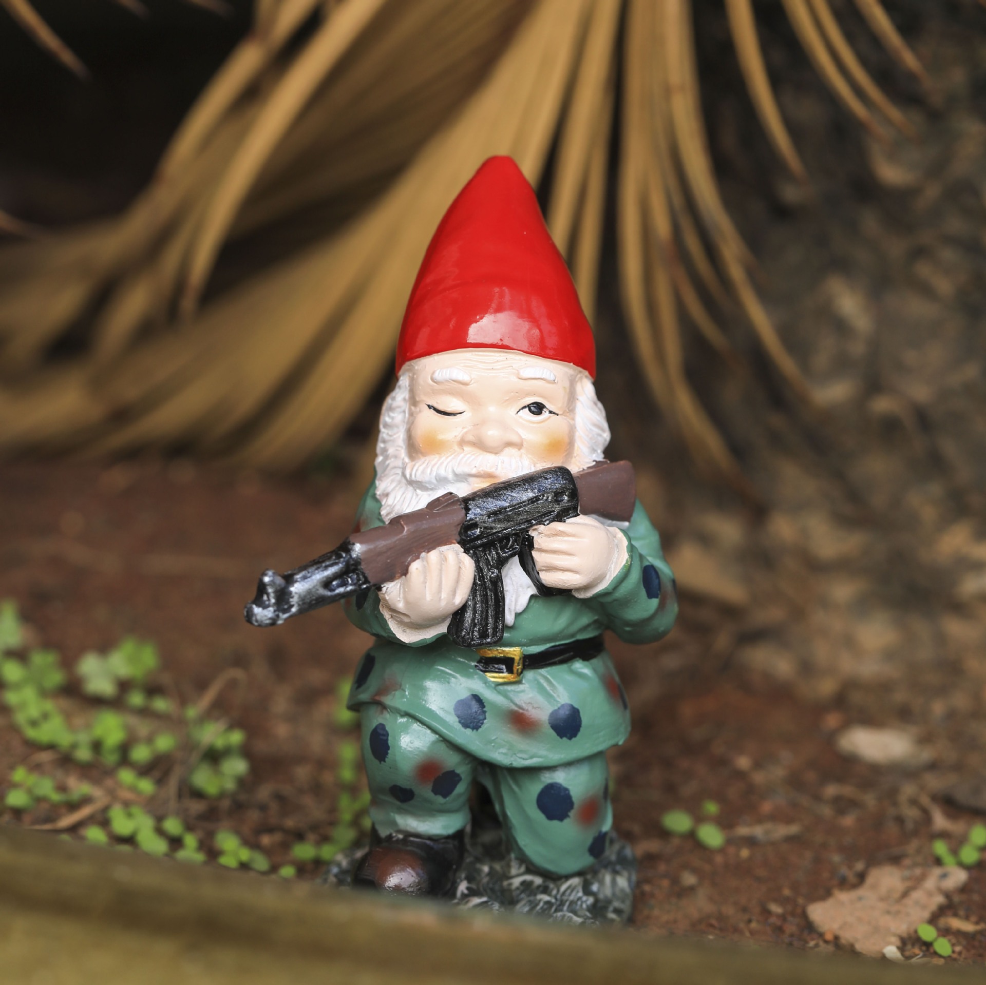 Close-up of a gnome with a painted winking face and white beard
