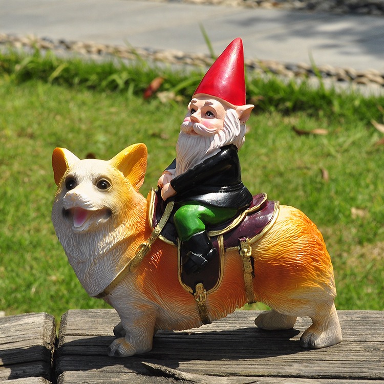 Gnome riding corgi figurine on a wooden bench over a green lawn