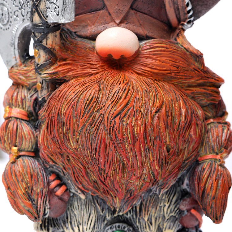 Close-up of the sculpted rust-red beard and braided plaits on the figure