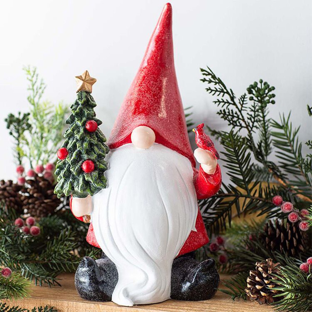 Gnome figurine on a wooden shelf with pine branches and pinecones