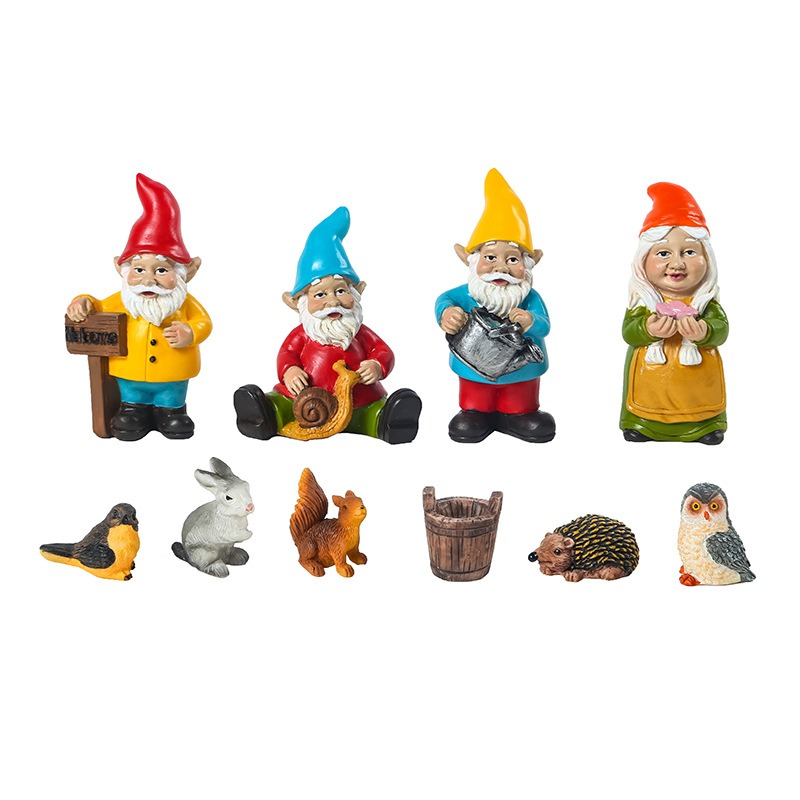 Resin gnome and woodland animal figures lined up in a row