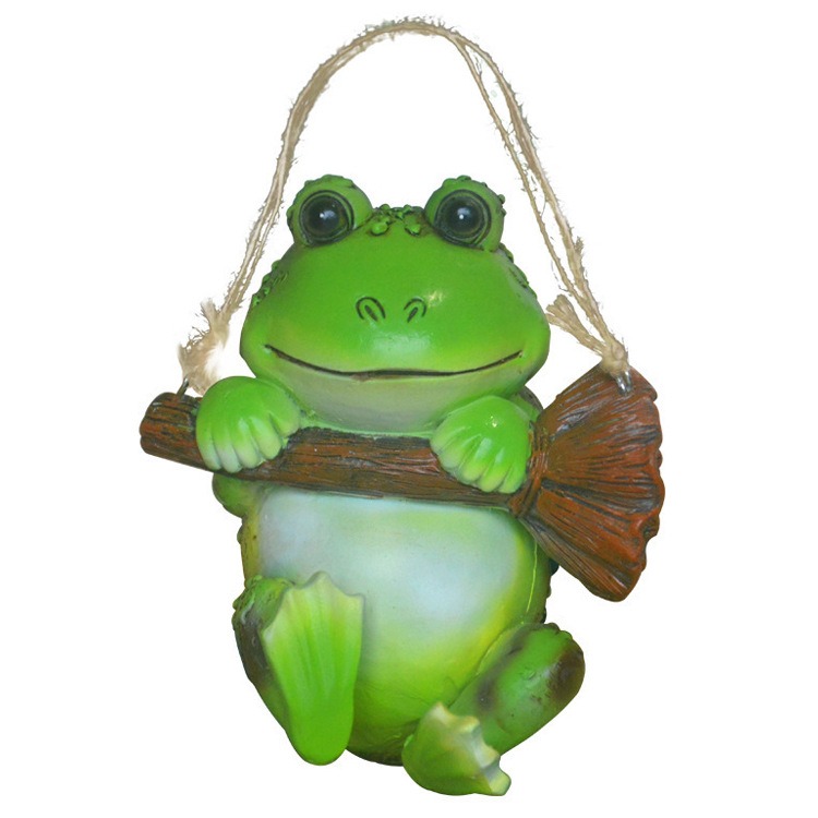 Full view of green resin frog pendant with jute hanging cord