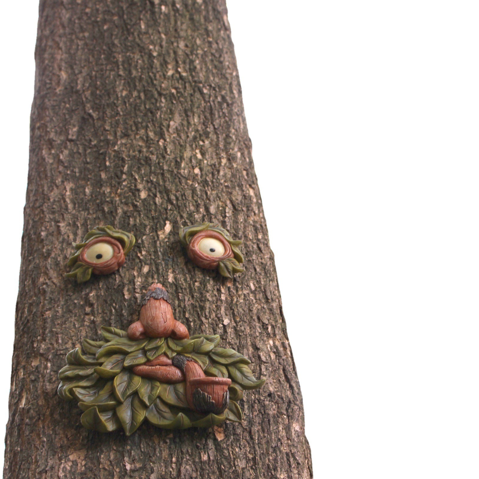 Plain tree trunk in the garden before the face is mounted