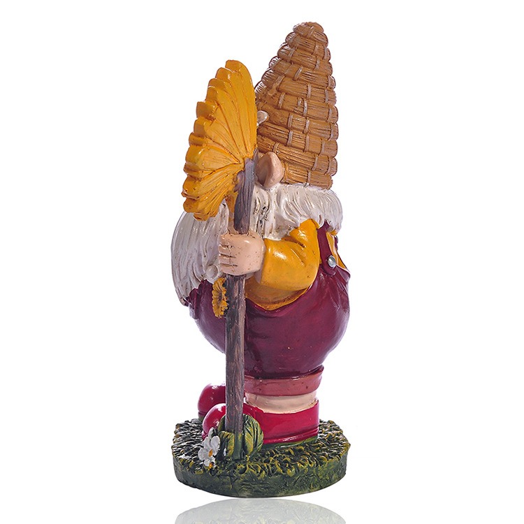 Side profile of gnome statue showing sunflower staff and hat depth