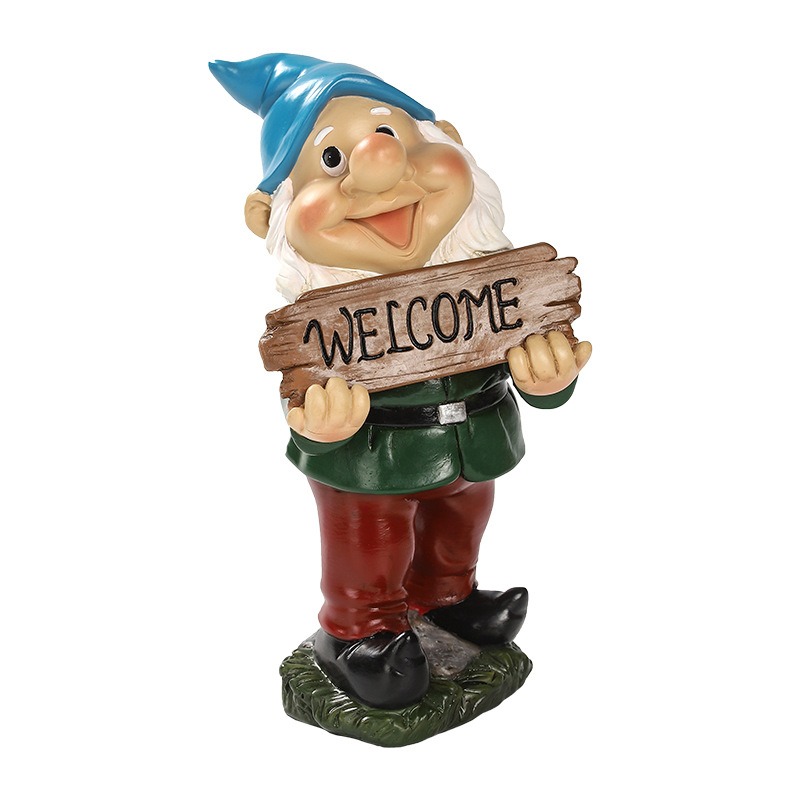 Garden gnome with WELCOME sign set beside a path