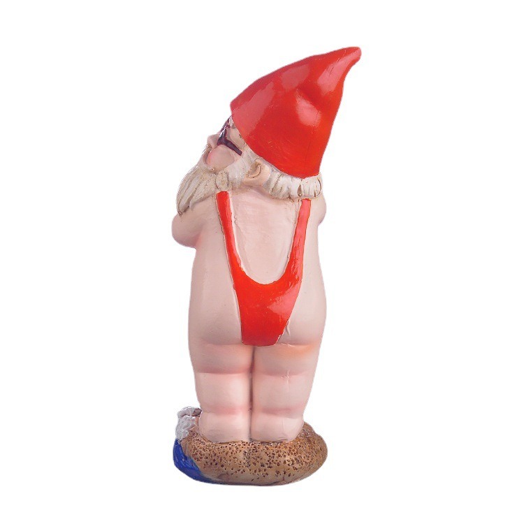 Rear view of surfing gnome in red swimsuit and red hat