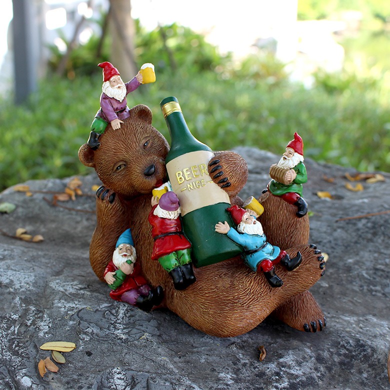 Bear and gnome garden sculpture shown in a neutral product photo