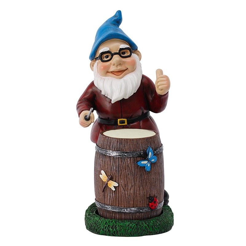 Resin drumming gnome with mallet and barrel drum on grass base
