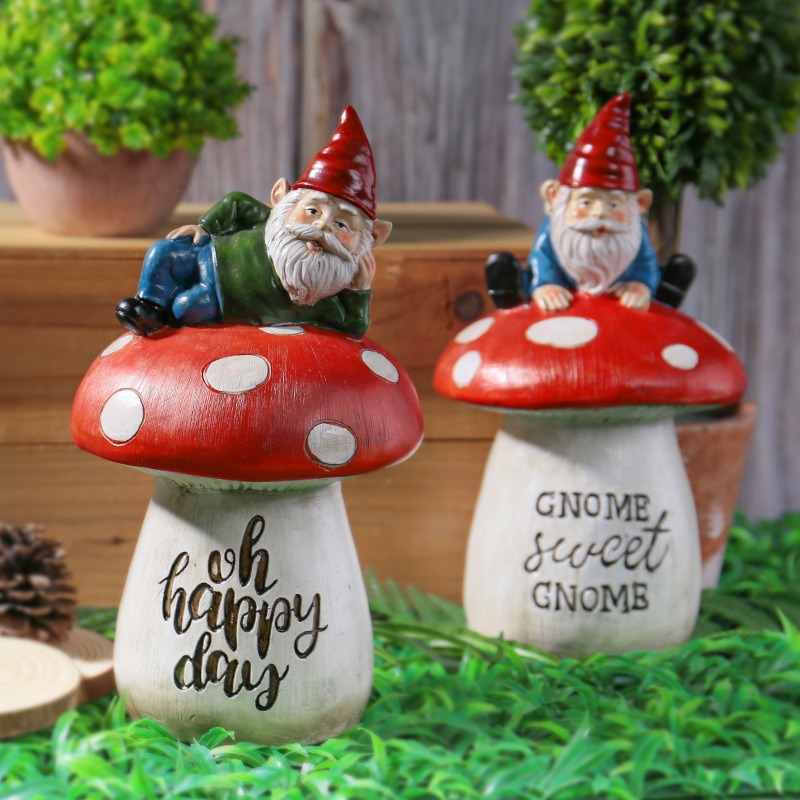 Gnome mushroom statues styled among potted plants and wood