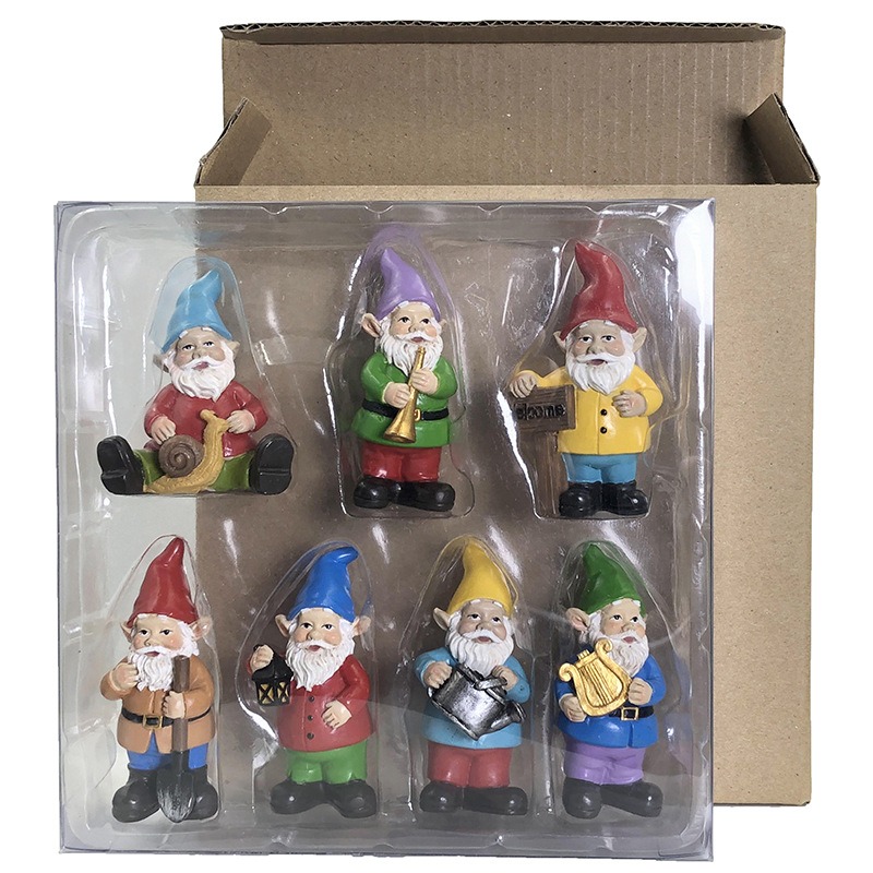 Gnome set on a clear tray in front of a plain cardboard box