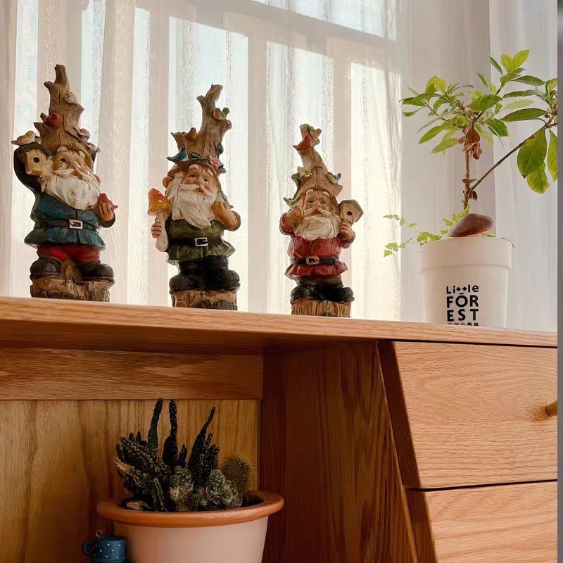 Hand-painted garden gnome figurine photographed as part of the product gallery