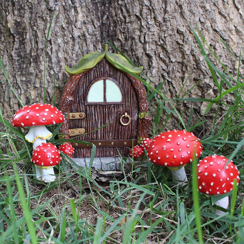 Red spotted toadstools with white speckles set in an outdoor garden