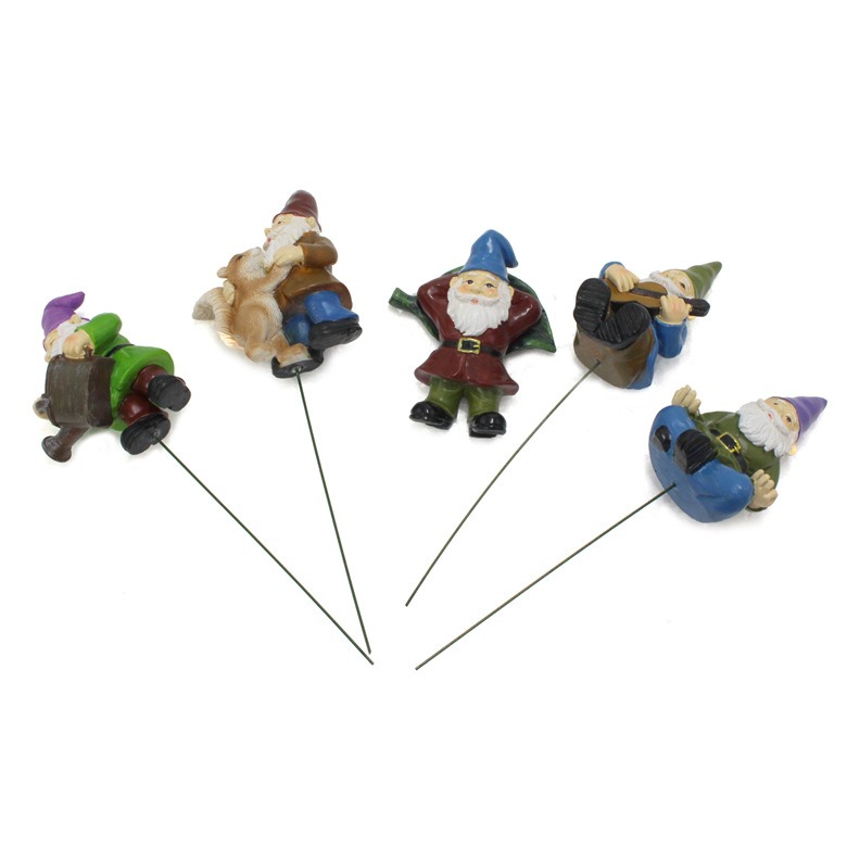 Five resin gnomes each standing on its own thin green wire stake