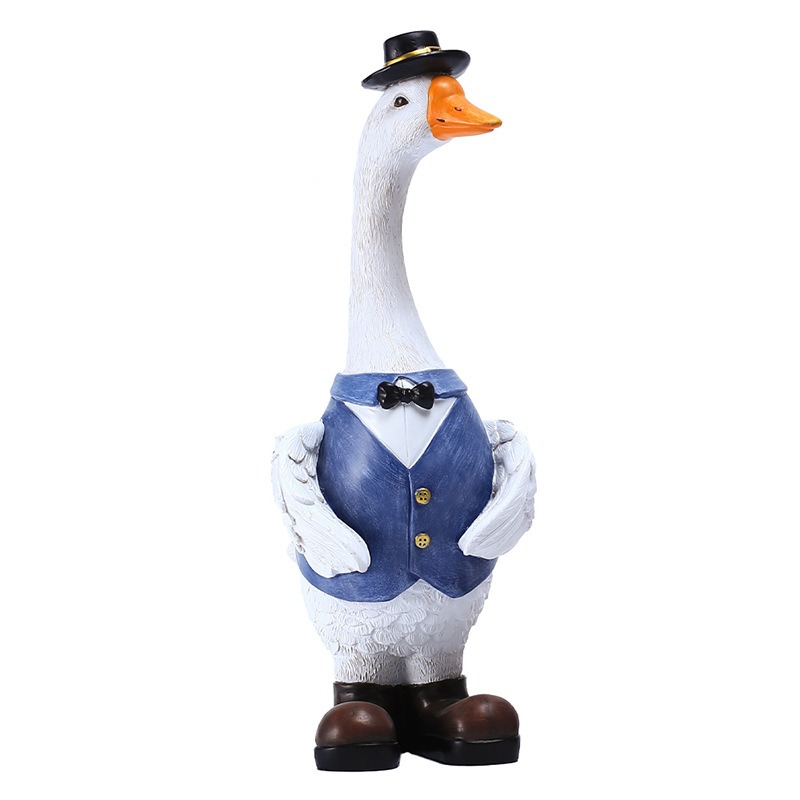 White resin goose in black top hat, blue vest and bow tie