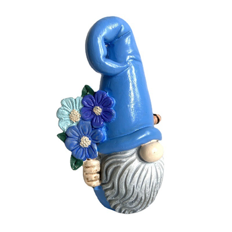 Faceless blue gnome with a flower bouquet and tall pointed hat