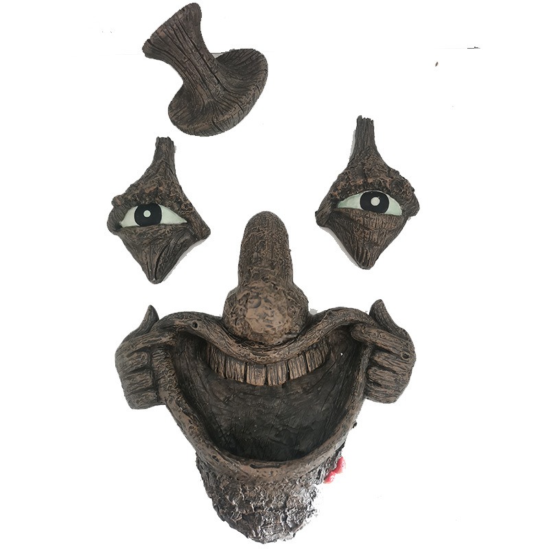Exploded view of tree face ornament parts on a white background