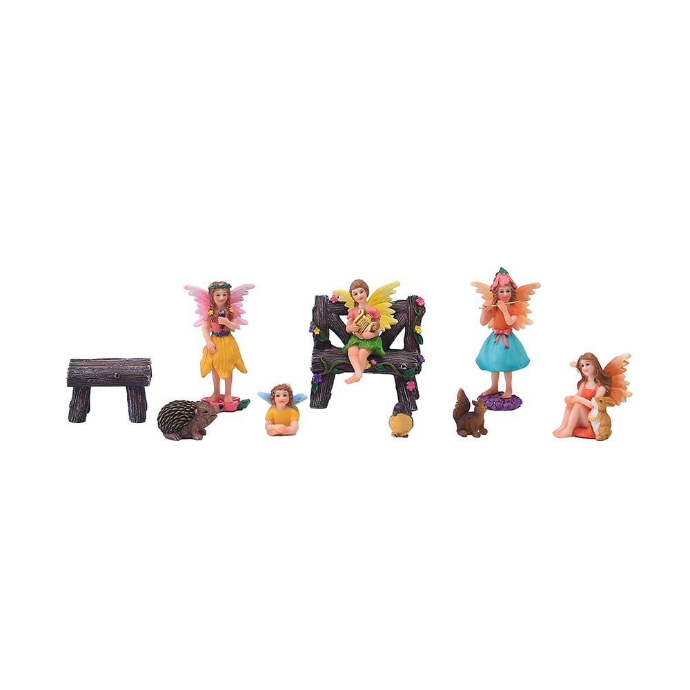 Full fairy figurine set laid out with log furniture and woodland animals
