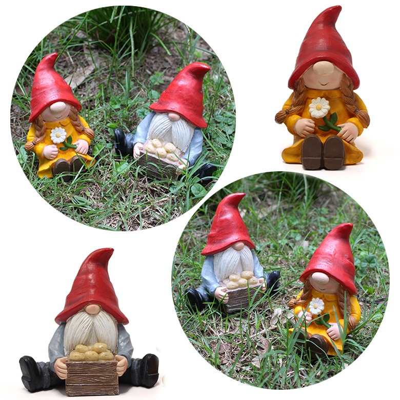 Gnome pair in a garden setting, one figure holding a flower