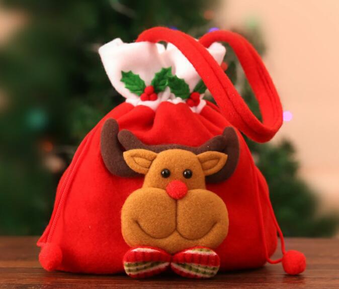 Close-up of reindeer-face Christmas bag with holly and bow tie