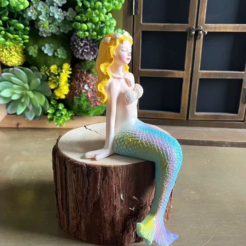 Resin mermaid figurine settled on a rim as a playful focal point