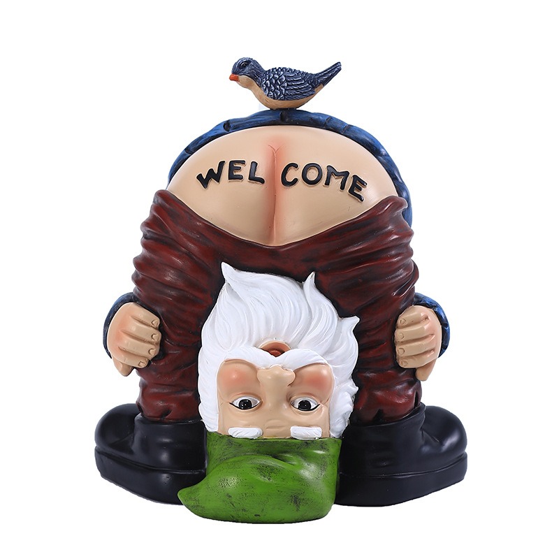 Upside-down gnome with bird on top and WEL COME text on the base