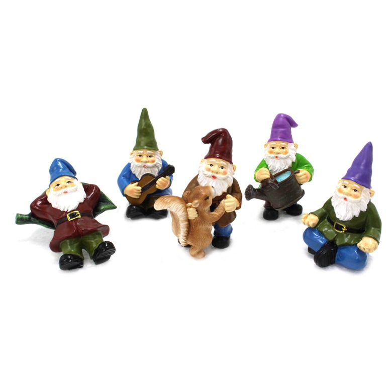 Five resin gnomes lined up without stakes, showing their painted coats and beards
