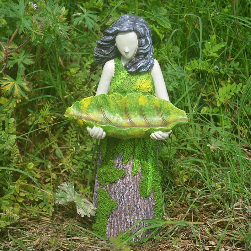 Forest green resin figure set in tall grass and wildflowers