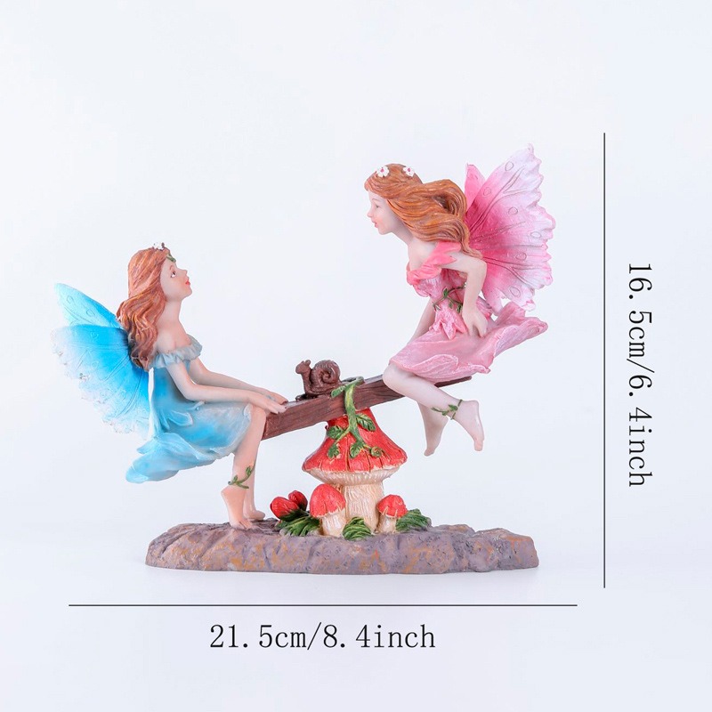 Fairy seesaw figurine with width and height dimension lines