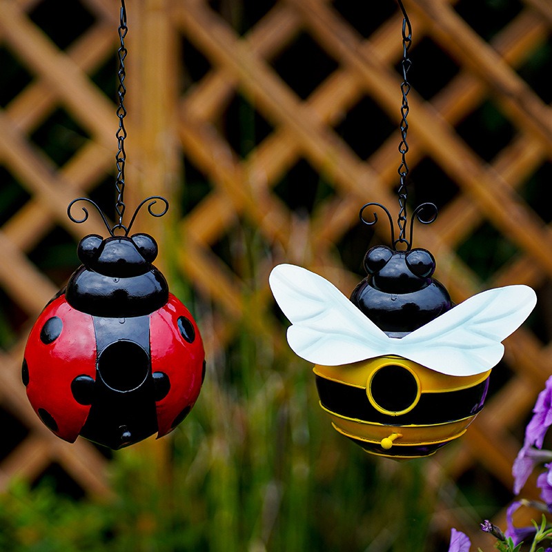 Bumblebee bird house photographed in a garden setting