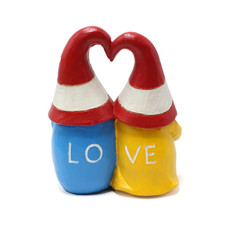 Back view of gnome couple showing LOVE letters and heart-shaped hat arch
