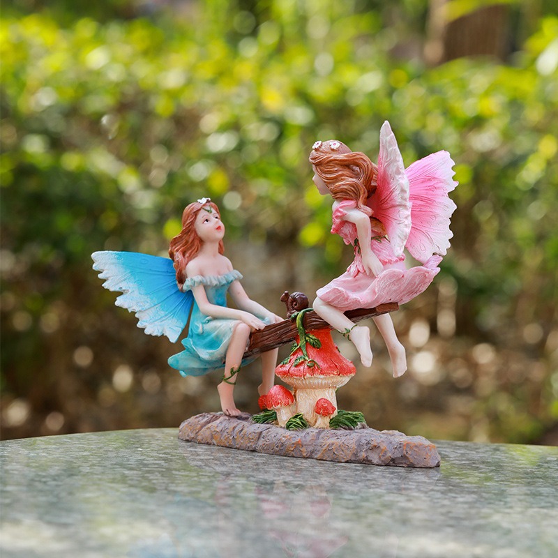 Sculpted rocky base of a fairy figurine on a neutral surface