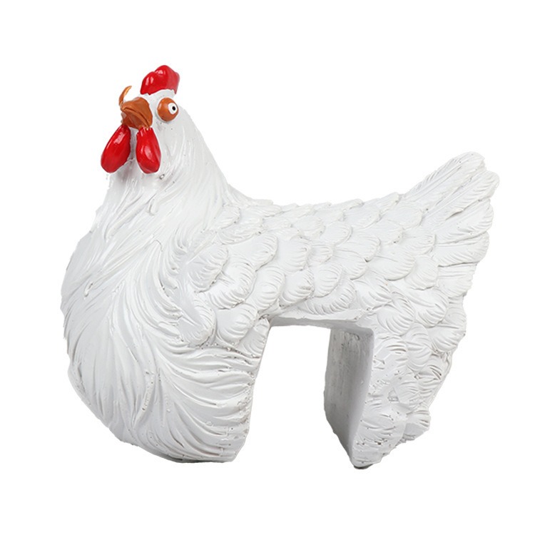 Creamy white resin hen ornament with textured feathers and red comb