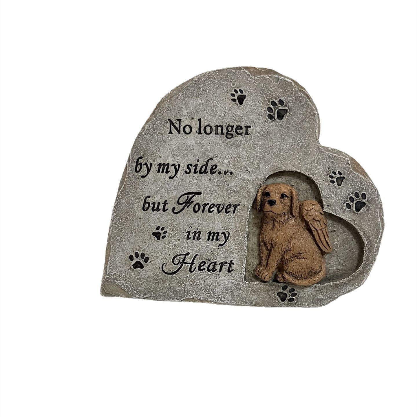 Dog memorial stone with engraved text and paw prints in the heart