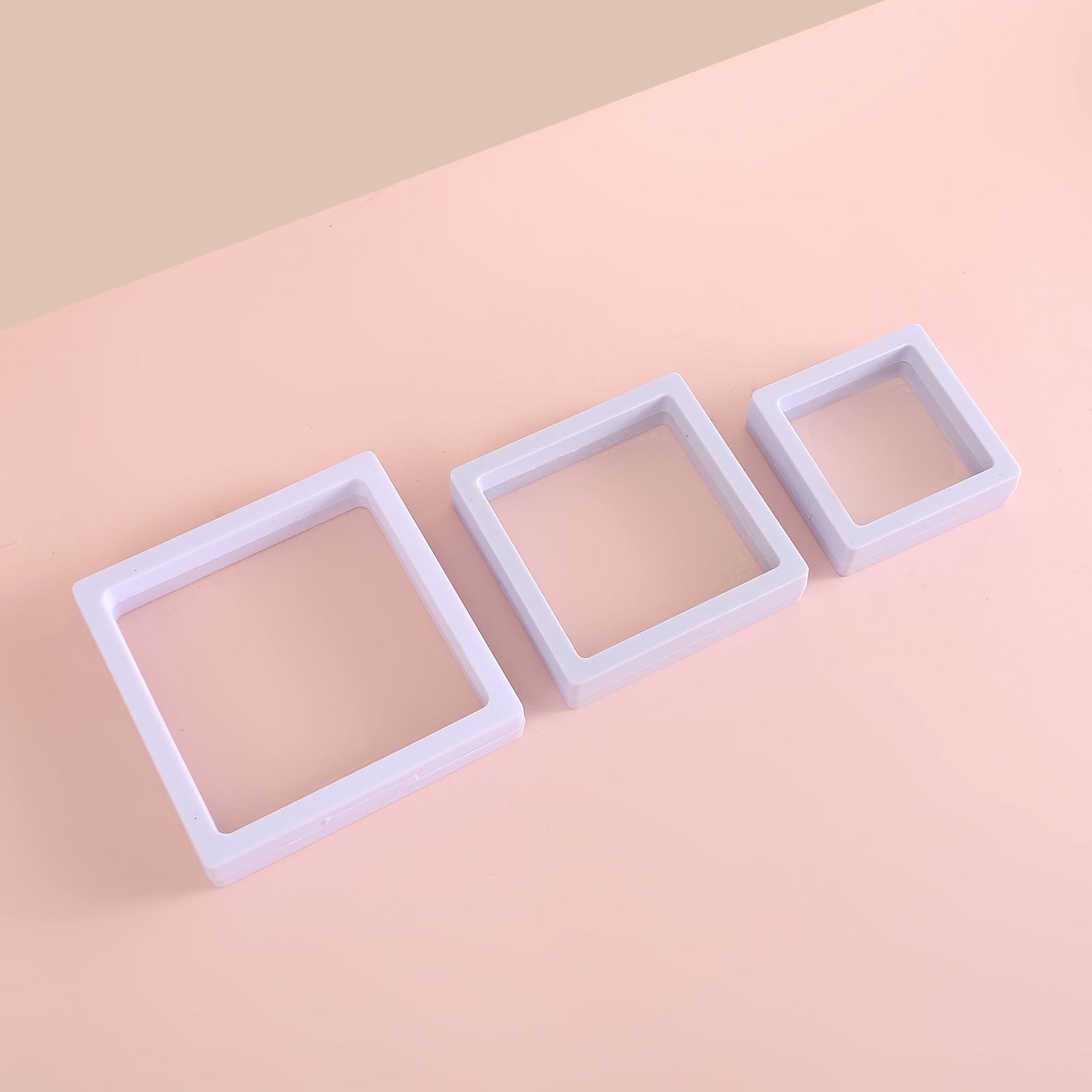 White square suspension box with clear film window showing how items display