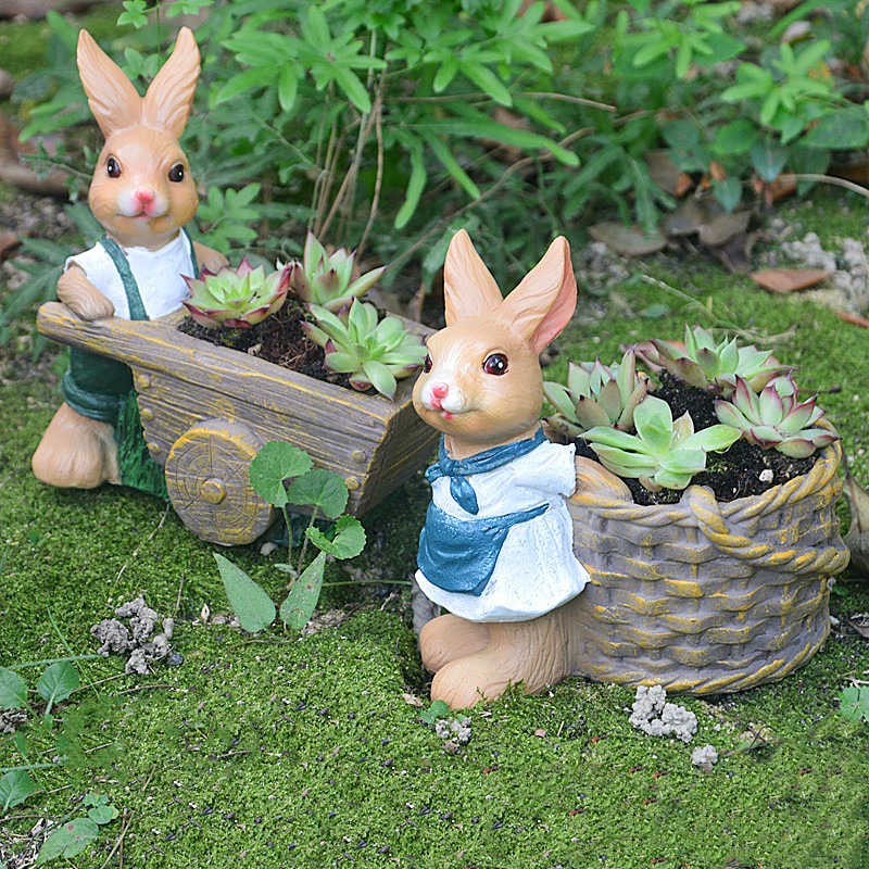 Rabbit planter with wood-grain cart and wheels holding succulents
