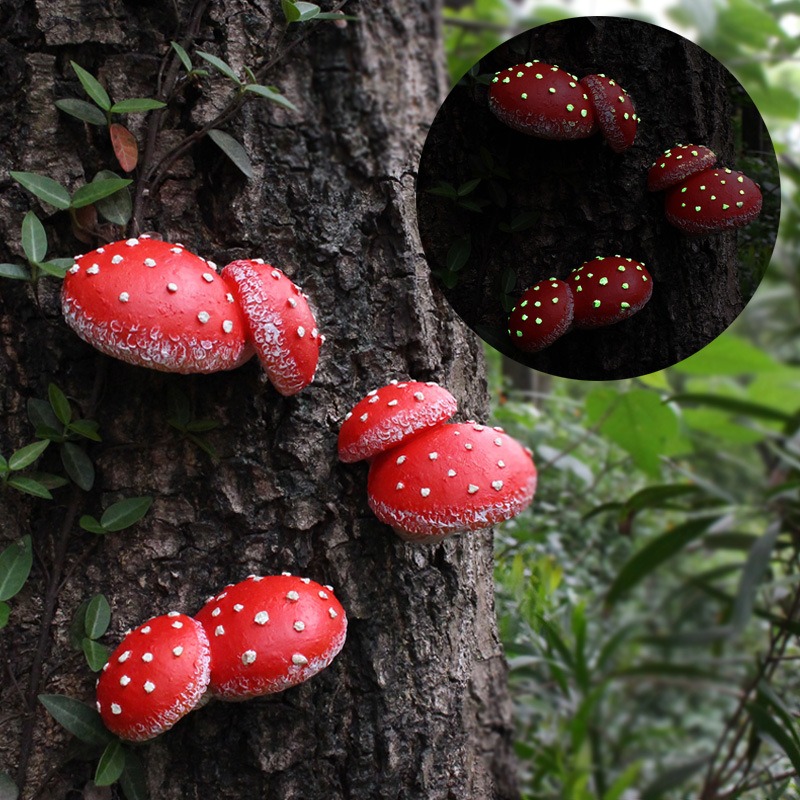 Red mushroom cluster mounted on bark in a green garden