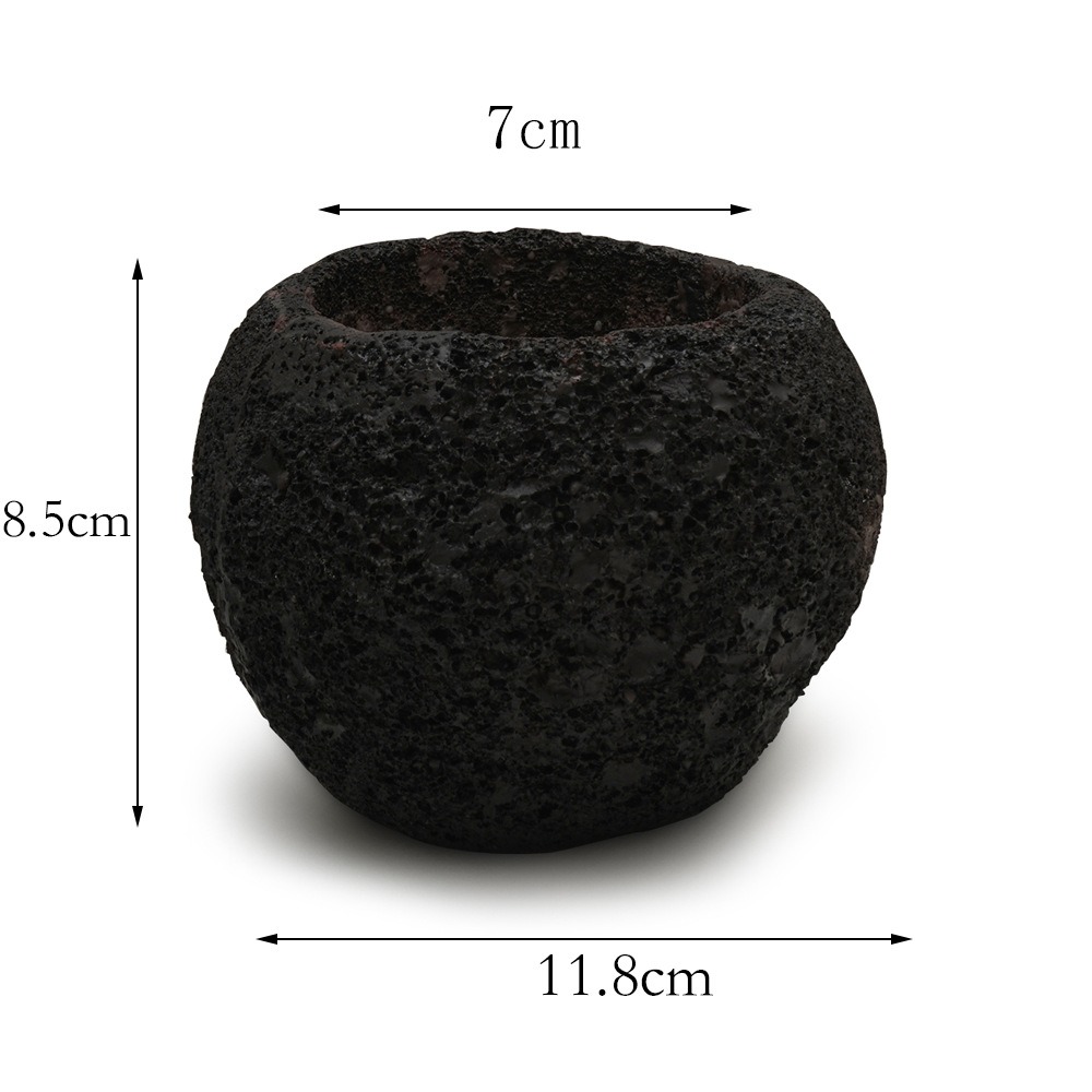 Black volcanic stone pot with dimension lines for width, height and opening