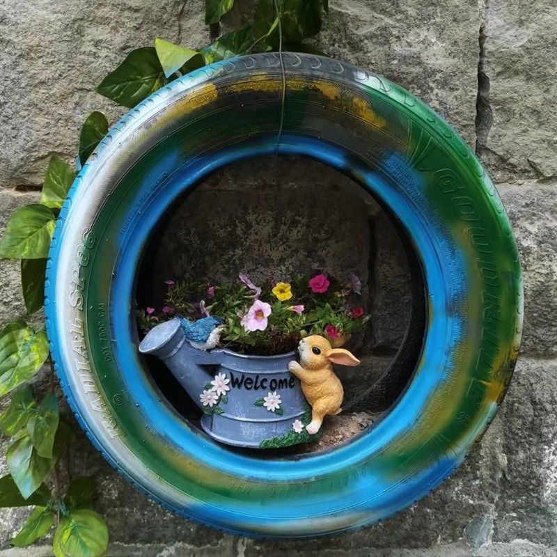 Planter on a wall with the bunny figurine visible on its side