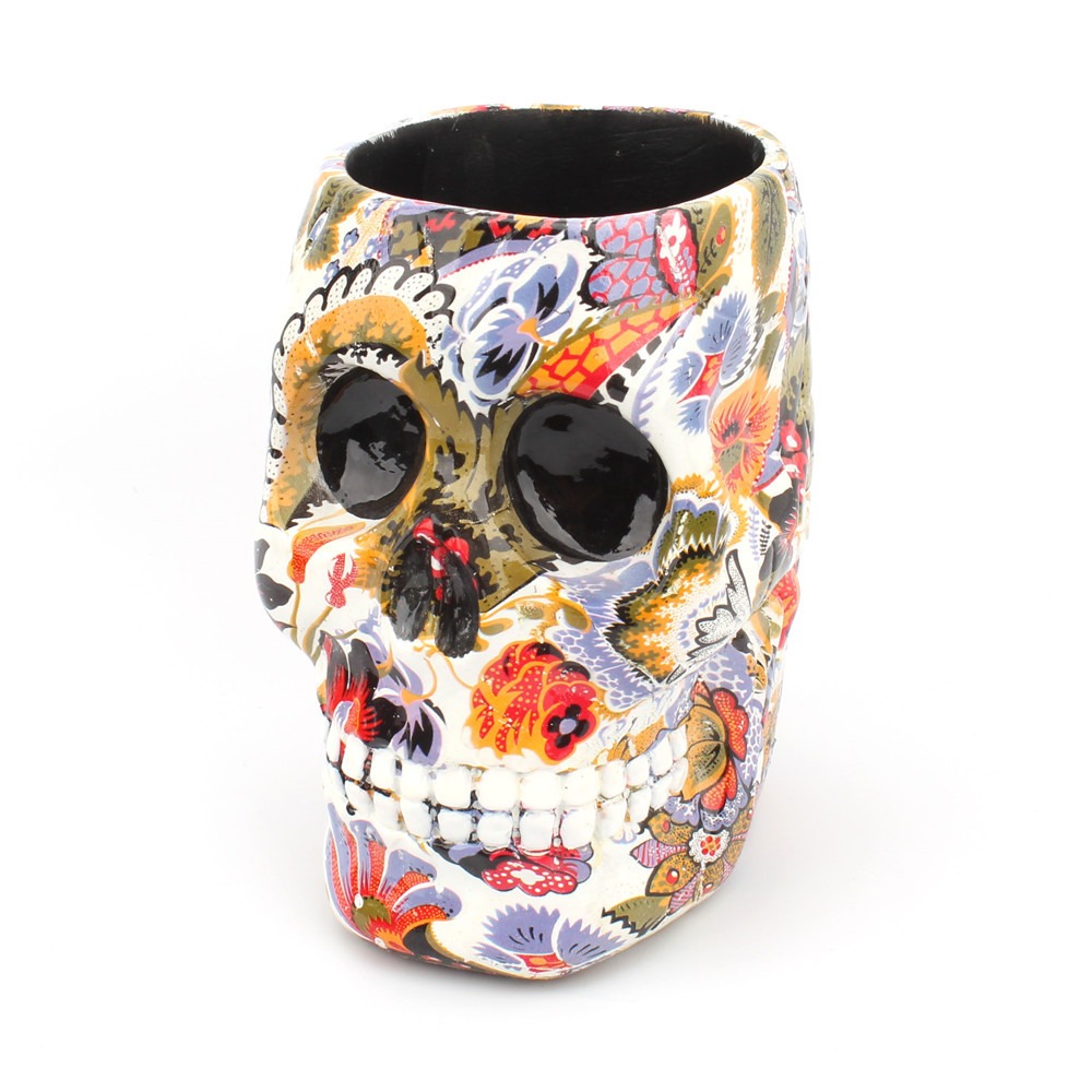 Floral skull pen holder at a three-quarter angle showing the open top