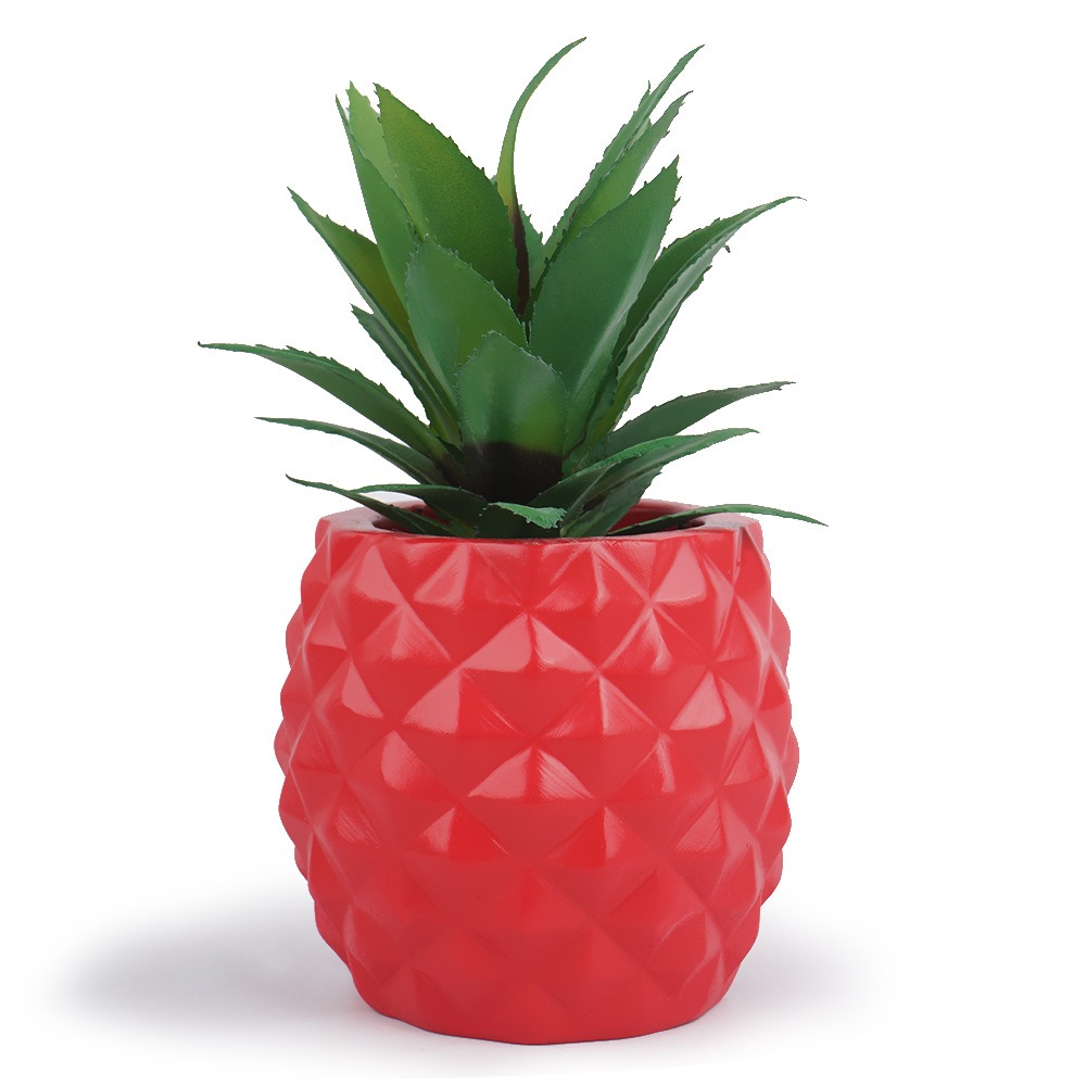 Red pineapple planter styled as a desk accent with no care required