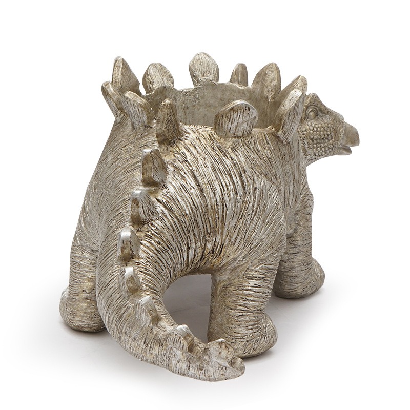 Rear view of stegosaurus planter showing tail spikes and open back cavity