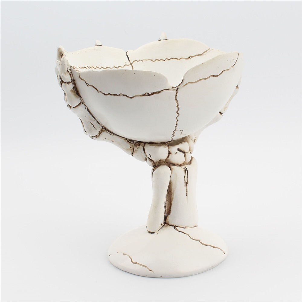 Low side view of a bowl on a skeletal hand stem